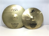 2 large Sabian cymbals.