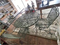Very nice vintage wrought iron table with four