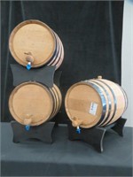 3 SMALL WOODEN DECORATIVE BARRELS ON STANDS