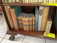 Bottom shelf of book case, books including The Dia
