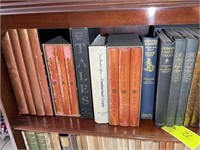 First shelf of book case, books including Daniel B