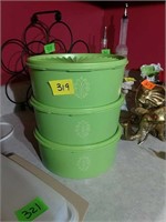 Three spring green Tupperware canisters