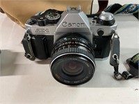 Canon AE-1 camera, lens, and bag