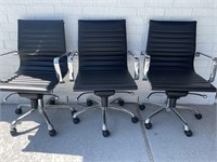 Three Modern Adjustable Swivel Office Chairs on