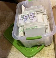 Tub with lid with boxes of new notecards, floral