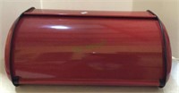 Metal red roll top bread box.    1545
