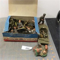 Box of Army action figures in hangar kit box