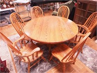 Pedestal 54" contemporary round oak table with