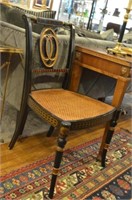 Three ebonized and painted chairs