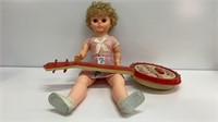 Kids banjo and a 20’’ bobble eyes plastic doll