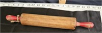 old red handle rolling pin