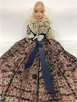 Vintage soft bodied doll with antique style dress