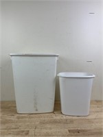 Two white trash bins