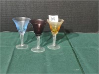 Trio of colorful hand blown glass cordials with