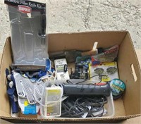 Box of fishing equipment and gloves. Fishing