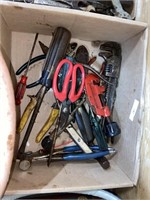 assorted tools including pipe wrenches and
