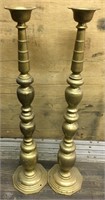 2 tall brass toned floor candlesticks         (d 6