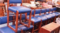 Nine oak chairs with blue leather upholstery,