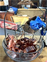 Wire basket of copper cookie cutters