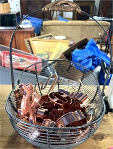 Wire basket of copper cookie cutters