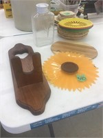 milk jug, cutting board, picnic plate holders,