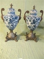 PAIR OF BLUE AND WHITE URNS, SOLID BRASS BASE