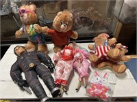 Assorted dolls and stuffed animals