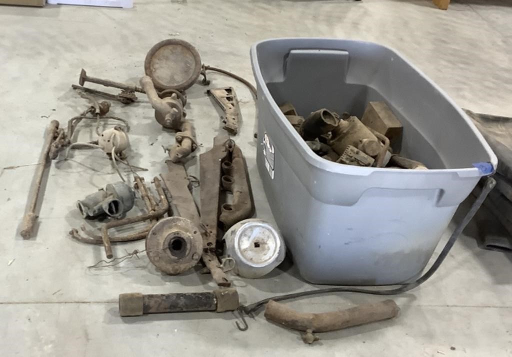 Tote of automobile parts-some Ford