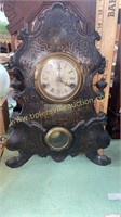 Antique wooden footed kitchen clock has cracked