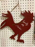 Handmade silhouette of a chicken which says early
