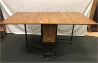 Craft table with expandable leaves and 4 drawers.