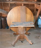 Antique claw foot round oak table