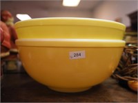 Two Pyrex yellow mixing bowls, 10 1/2" diameter