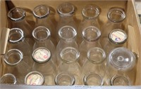 BOX OF CLEAR GLASS MILK BOTTLES