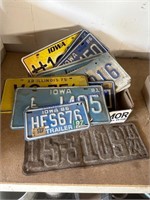 LICENSE PLATES, 1924 AND 1980'S, IN GARAGE