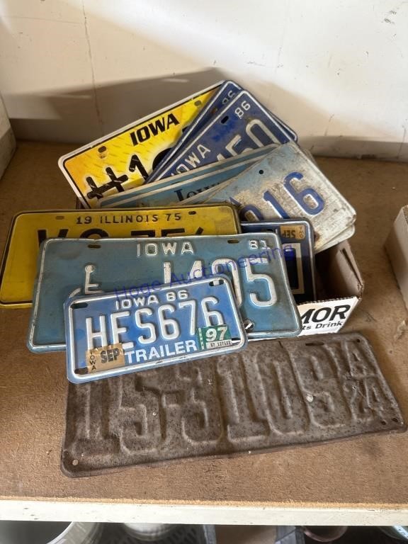 LICENSE PLATES, 1924 AND 1980'S, IN GARAGE