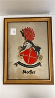 Hand etched stone family crest in frame “Stocker”