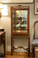 Carved wood vitrine with faux bamboo legs