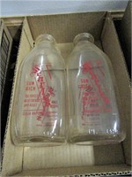 Two Advertising Milk Bottles
