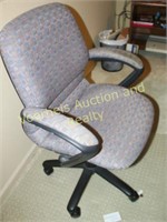 Office chair on rollers and chair mat