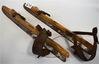 Pair of wooden strap-on ice skates,
