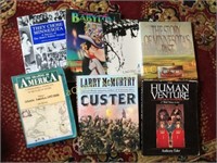 assorted books Custer Human Venture