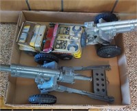 flat of toy plastic cannons and tin Jeep