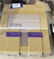 Super Nintendo with two controllers, AC adapter