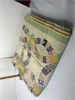 Hand stitched wedding ring quilt not in the best