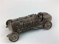 Metal cast race car toy.  See photos for wear,