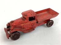 Red metal cast toy dump truck.  See photos for