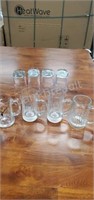 4 glass beer mugs, 4 tall drinking glasses