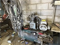 Large air compressor. With air tools and hoses.