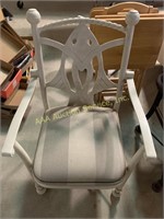 Ivory metal chair with fish design on the back,